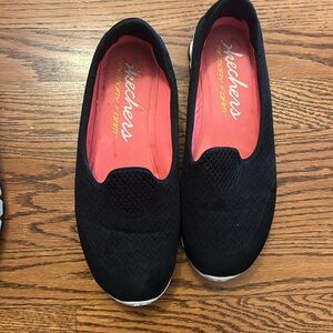 Skechers Black Slip-On Sneakers with Sleek Design